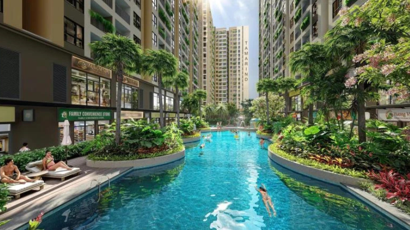 Hình ảnh phối cảnh tiện ích hồ bơi tại Bcons Central Park với mặt nước xanh, khu vực nghỉ ngơi và cảnh quan cây xanh nằm giữa các tòa căn hộ. Hình ảnh minh họa không gian tiện ích nội khu, giúp người đọc hình dung môi trường sinh hoạt và thư giãn được giới thiệu trong dự án.