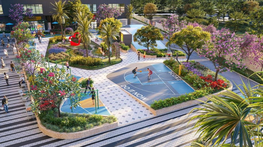 Hình ảnh phối cảnh không gian tiện ích ngoài trời tại Bcons Central Park, nổi bật với sân bóng rổ, đường đi bộ, khu vực nghỉ chân và hệ thống cây xanh, hoa cảnh được bố trí xung quanh. Thiết kế hướng đến việc kết hợp không gian vận động, thư giãn và kết nối cộng đồng cư dân.